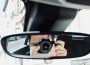 person holding black camera lens